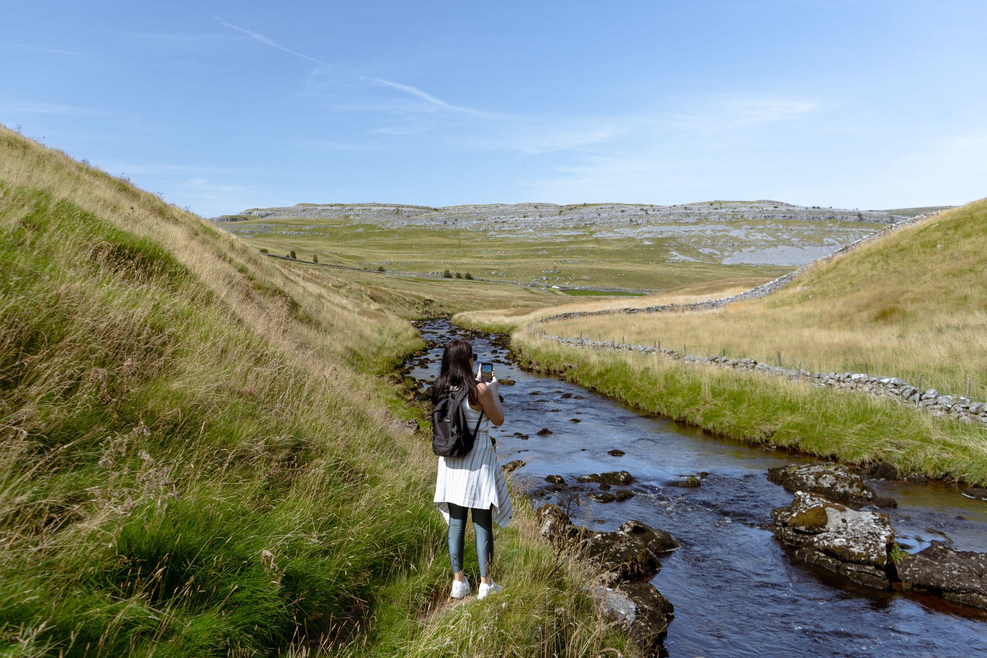 A walker exploring the South West Coast Path